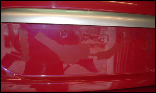 Paint taken off by removal of numberplate