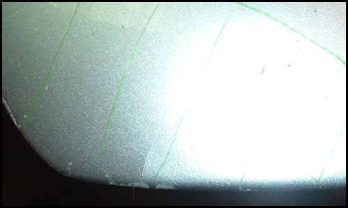 Cracked bodywork and chipped paint