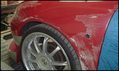 Poorly adhered paint being removed